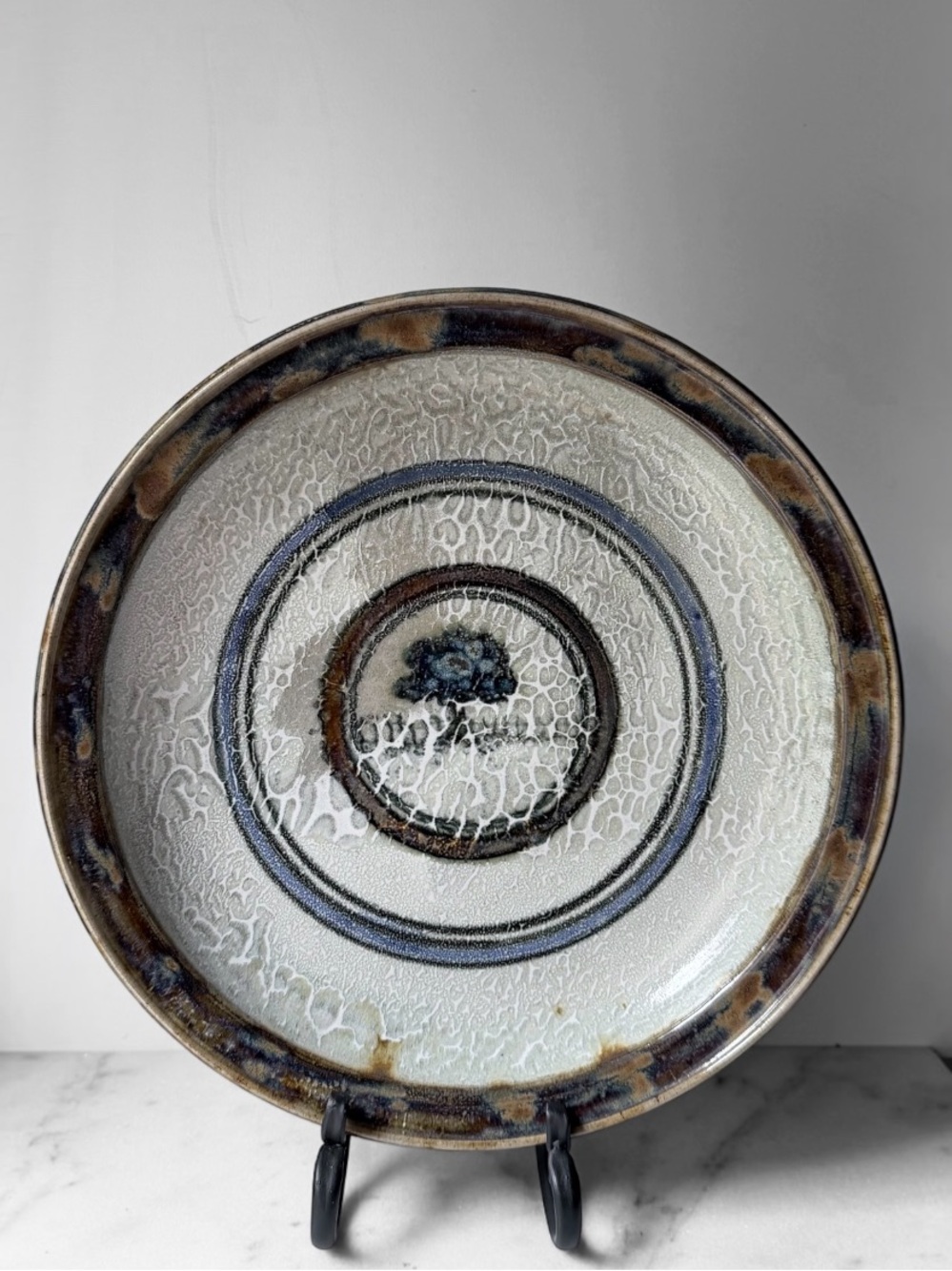 vintage studio art pottery bowl or plate with distinctive crackle glaze finish.